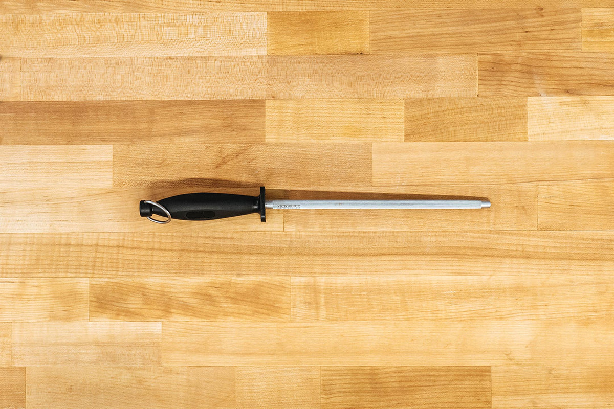 What is the difference between sharpening a knife and honing a knife?